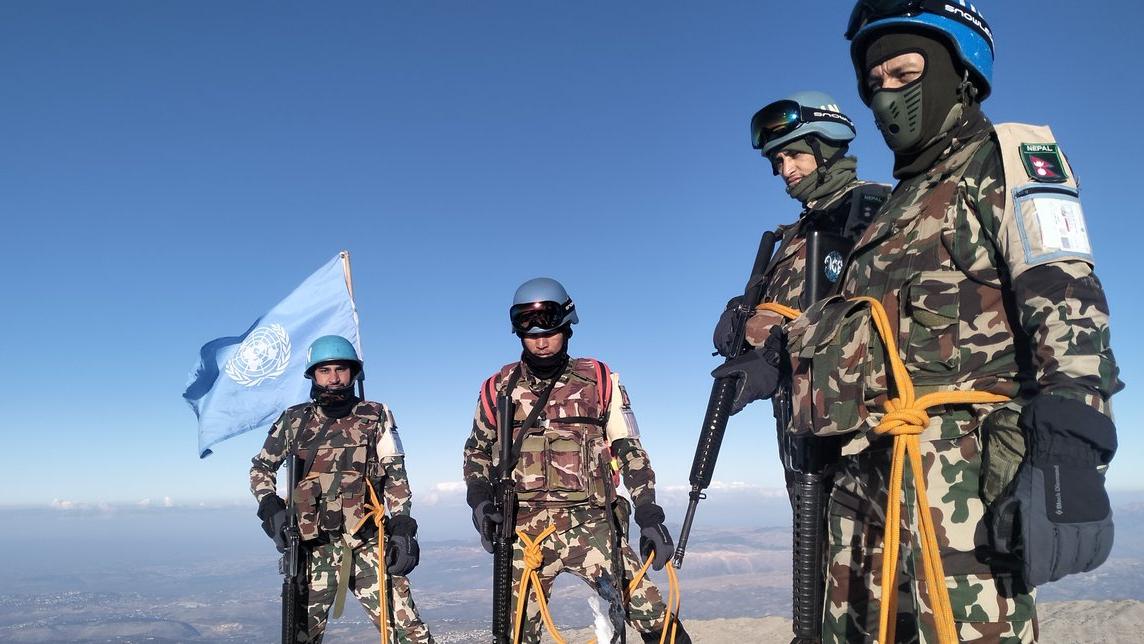 peacekeepers standing in the snow.
