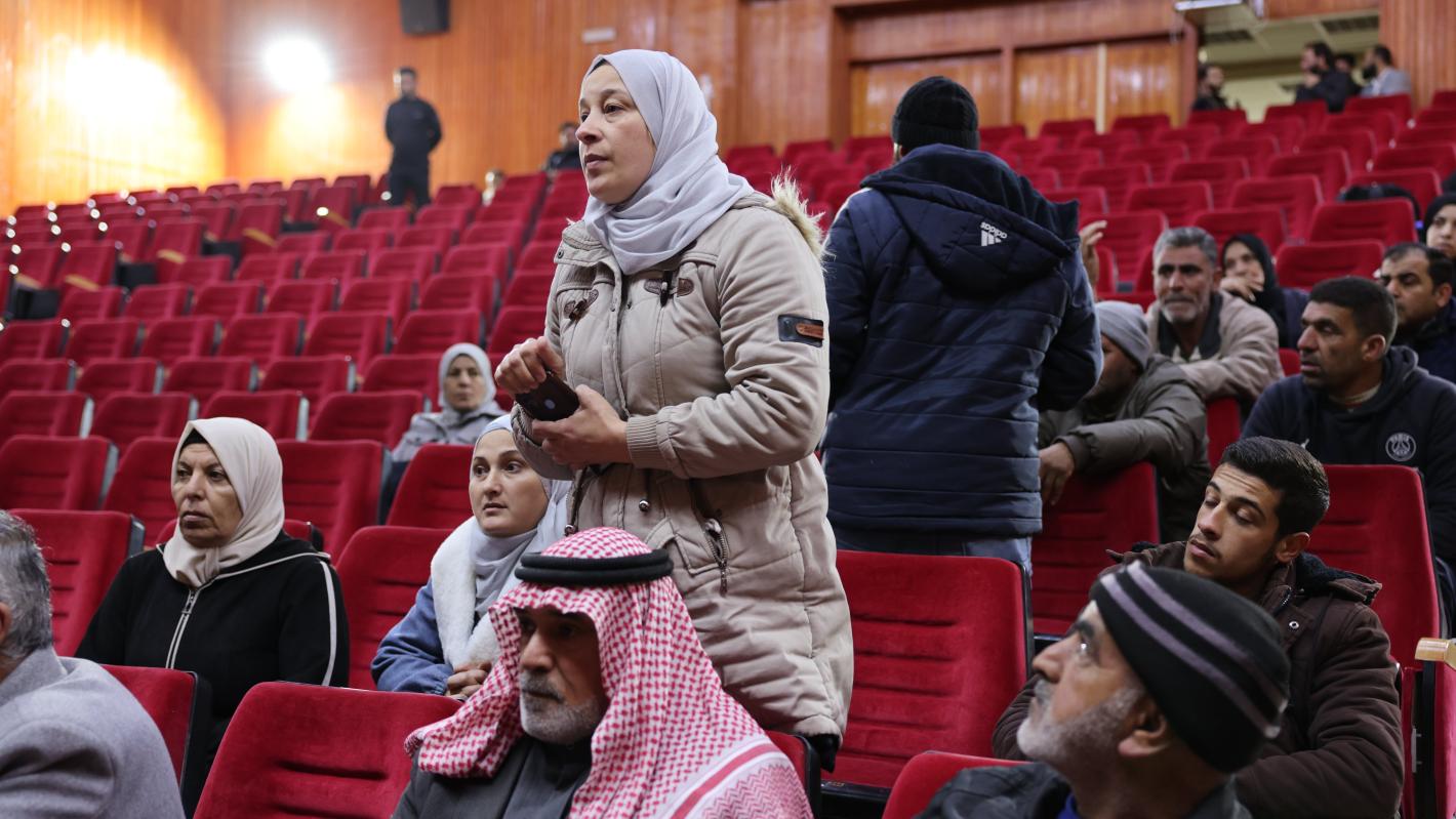 people standing in arena speaking