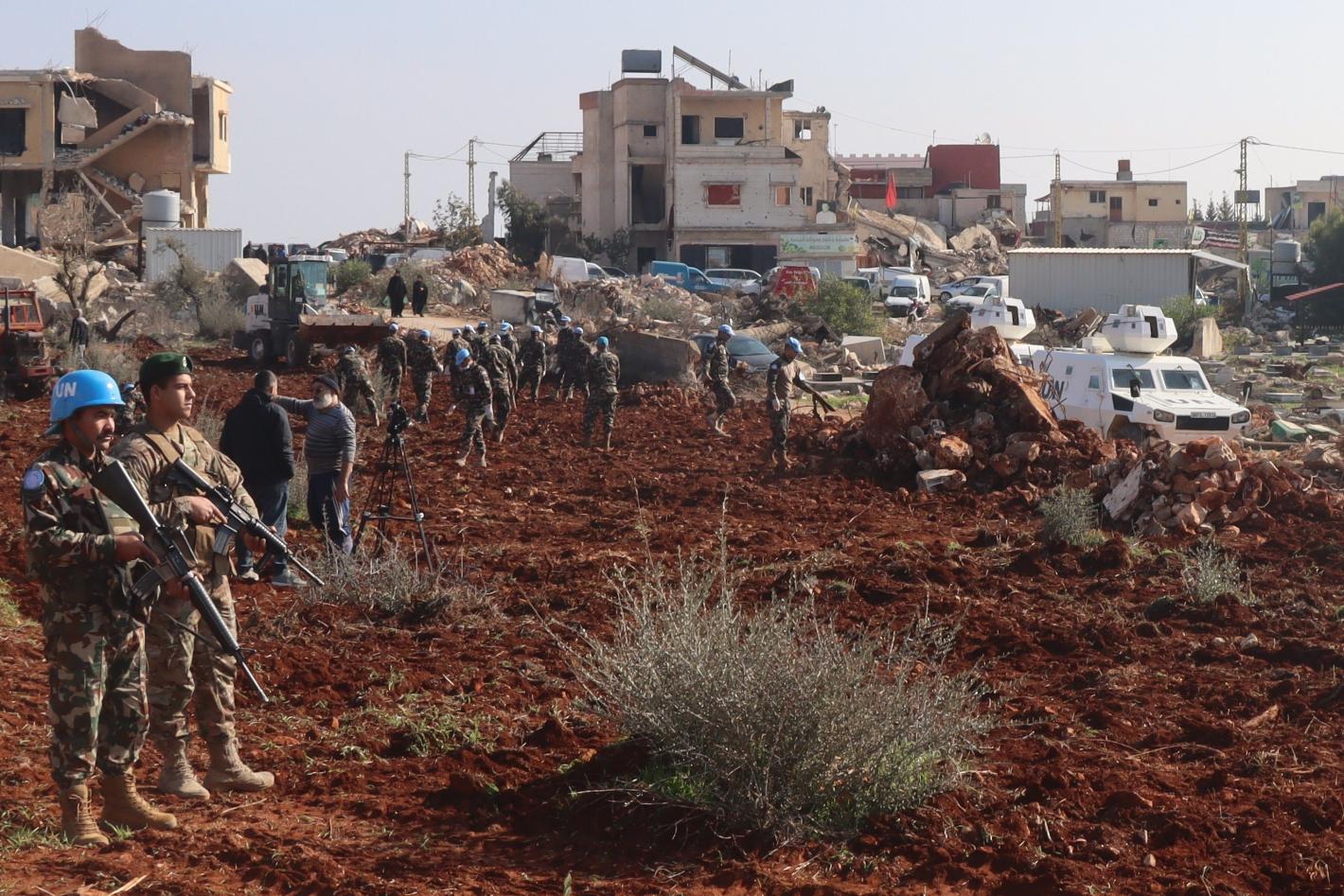 Peacekeepers assist Blida residents to prepare field for olive plantation