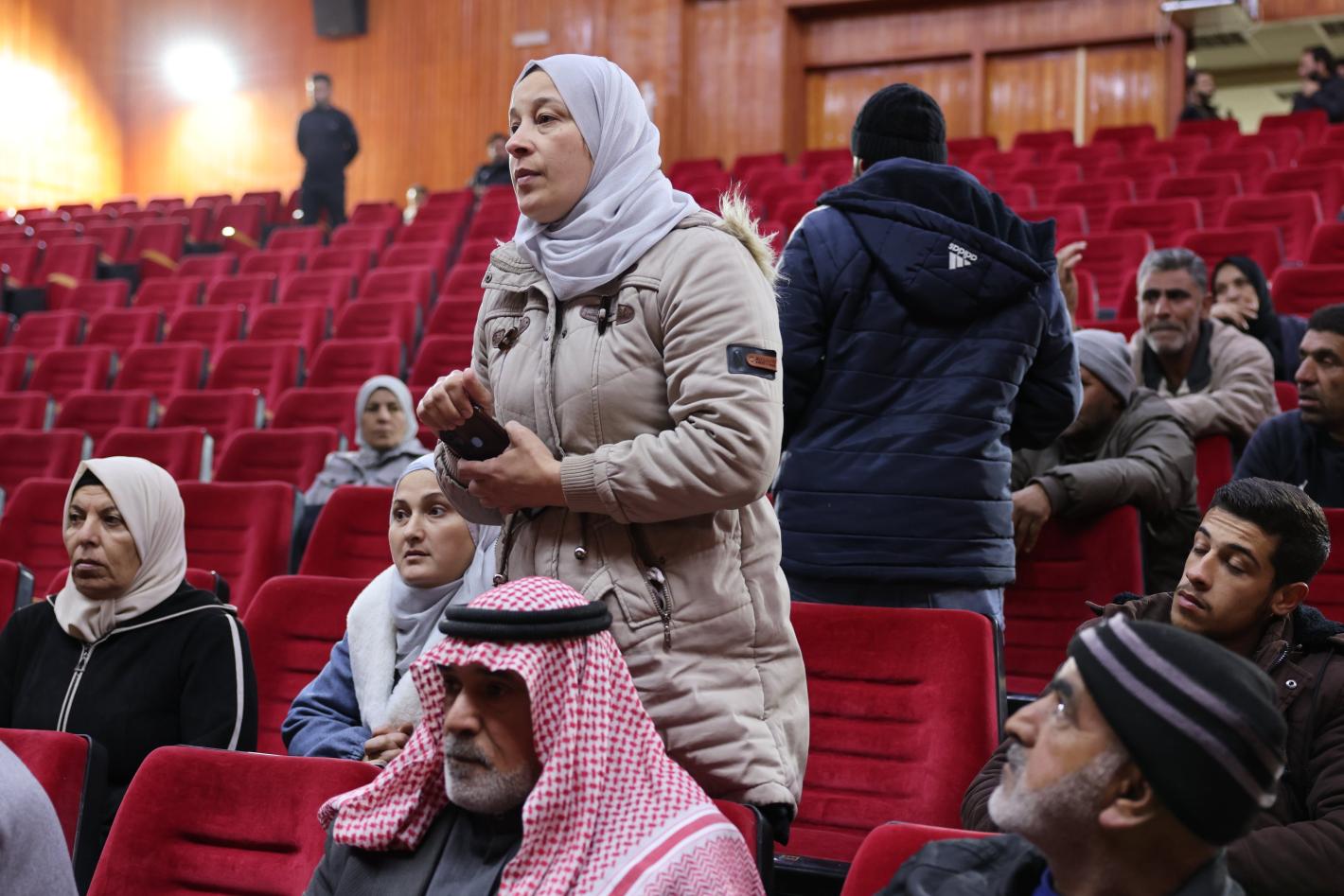 people standing in arena speaking