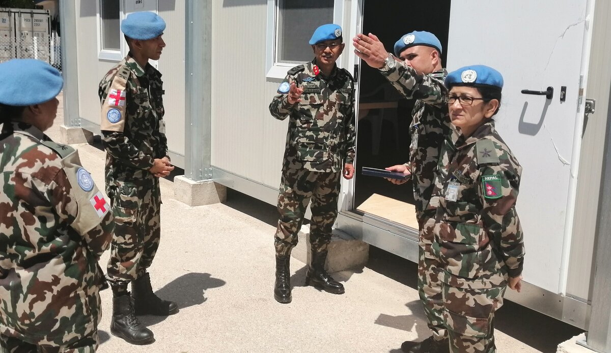 Lt. Col. Dr. Narayan Thapa briefing the HoM/FC Major General Ishwar Hamal on COVID - 19 capabilites