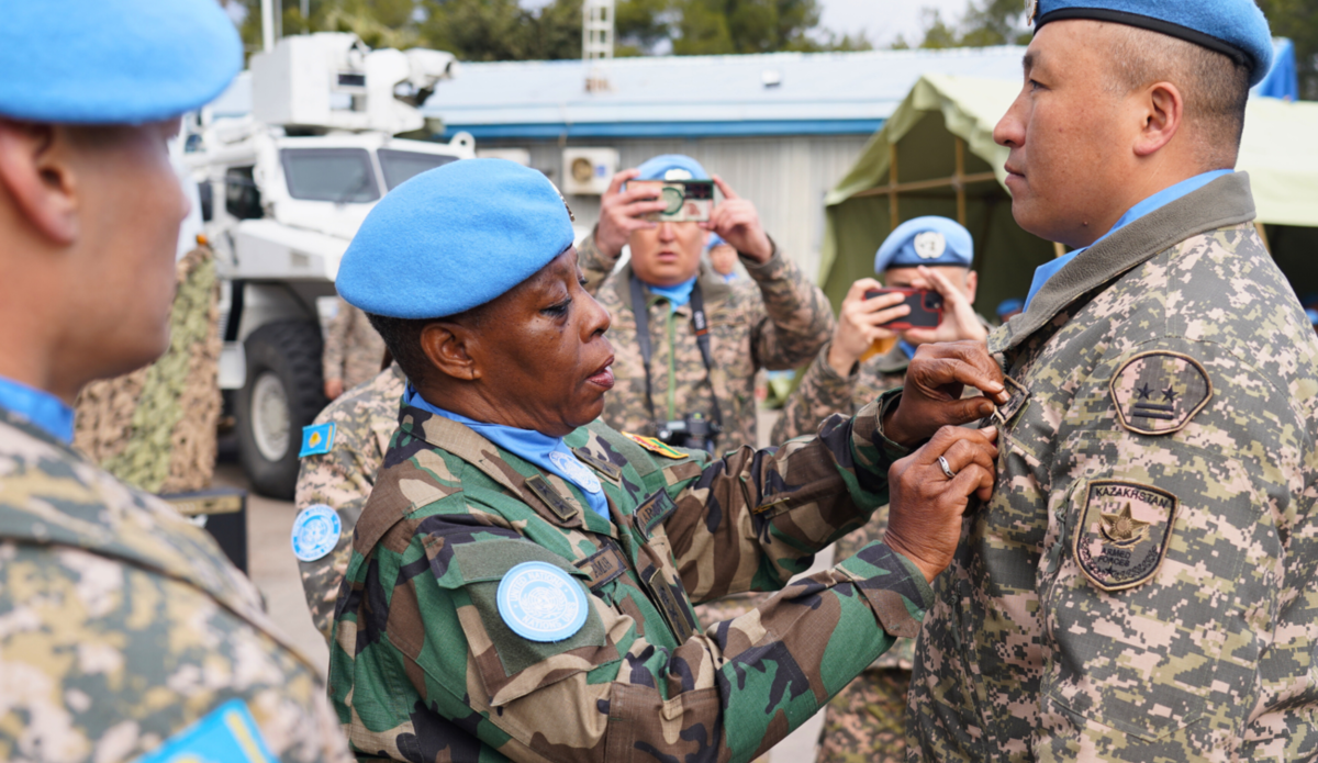 FC presenting UNDOF medal to OC KAZCON